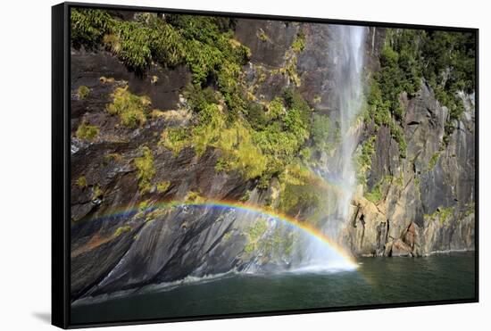 A Tall Waterfall Drops Off a Steep Cliff into Waters, Milford Sound on South Island, New Zealand-Paul Dymond-Framed Stretched Canvas