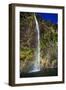 A Tall Waterfall Drops Off a Steep Cliff into Waters, Milford Sound on South Island, New Zealand-Paul Dymond-Framed Photographic Print