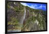 A Tall Waterfall Drops Off a Steep Cliff into Waters, Milford Sound on South Island, New Zealand-Paul Dymond-Framed Photographic Print