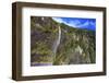 A Tall Waterfall Drops Off a Steep Cliff into Waters, Milford Sound on South Island, New Zealand-Paul Dymond-Framed Photographic Print