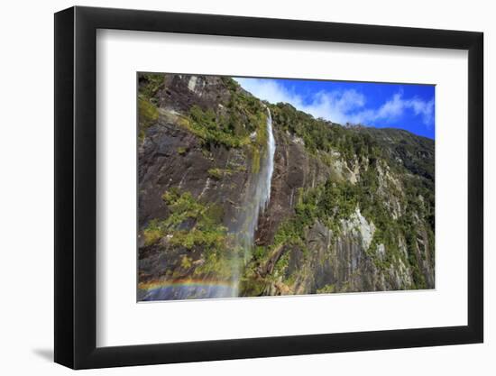 A Tall Waterfall Drops Off a Steep Cliff into Waters, Milford Sound on South Island, New Zealand-Paul Dymond-Framed Photographic Print