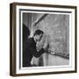 A Teacher Writing on a Blackboard at Northfield House Junior School, Leicester-Henry Grant-Framed Photographic Print