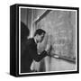 A Teacher Writing on a Blackboard at Northfield House Junior School, Leicester-Henry Grant-Framed Stretched Canvas