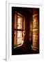 A Tibetan woman stands next to a large prayer wheel of the temple of Boudhanath Stupa, Kathmandu, N-Julian Bound-Framed Photographic Print