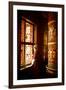 A Tibetan woman stands next to a large prayer wheel of the temple of Boudhanath Stupa, Kathmandu, N-Julian Bound-Framed Photographic Print