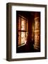 A Tibetan woman stands next to a large prayer wheel of the temple of Boudhanath Stupa, Kathmandu, N-Julian Bound-Framed Photographic Print