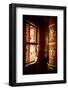 A Tibetan woman stands next to a large prayer wheel of the temple of Boudhanath Stupa, Kathmandu, N-Julian Bound-Framed Photographic Print