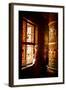 A Tibetan woman stands next to a large prayer wheel of the temple of Boudhanath Stupa, Kathmandu, N-Julian Bound-Framed Photographic Print