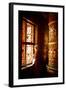 A Tibetan woman stands next to a large prayer wheel of the temple of Boudhanath Stupa, Kathmandu, N-Julian Bound-Framed Photographic Print