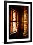 A Tibetan woman stands next to a large prayer wheel of the temple of Boudhanath Stupa, Kathmandu, N-Julian Bound-Framed Photographic Print