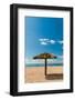 A tiki umbrella on a palm tree trunk on Pinney's white sand beach. Nevis Island, West Indies.-Sergio Pitamitz-Framed Photographic Print