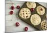 A Tin Filled with Small Fresh Cherry Pies Ready to Go into the Oven-Cynthia Classen-Mounted Photographic Print