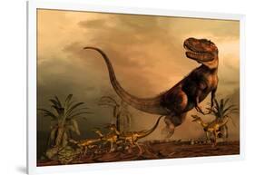 A Torvosaurus on the Prowl While a Group of Ornitholestes Flee a Hasty Retreat-null-Framed Art Print