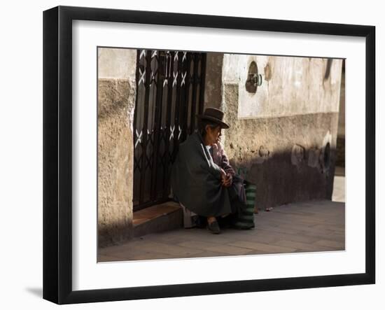 A Traditional Bolivian Woman Sits on a Doorstep in Potosi at Sunset-Alex Saberi-Framed Premium Photographic Print
