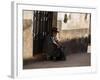 A Traditional Bolivian Woman Sits on a Doorstep in Potosi at Sunset-Alex Saberi-Framed Photographic Print