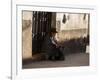 A Traditional Bolivian Woman Sits on a Doorstep in Potosi at Sunset-Alex Saberi-Framed Photographic Print