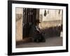 A Traditional Bolivian Woman Sits on a Doorstep in Potosi at Sunset-Alex Saberi-Framed Photographic Print