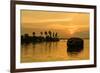 A traditional houseboat moves past the setting sun on the Kerala Backwaters, Kerala, India, Asia-Logan Brown-Framed Photographic Print