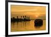 A traditional houseboat moves past the setting sun on the Kerala Backwaters, Kerala, India, Asia-Logan Brown-Framed Photographic Print