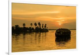 A traditional houseboat moves past the setting sun on the Kerala Backwaters, Kerala, India, Asia-Logan Brown-Framed Photographic Print