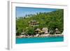 A traditional Thai resort overlooks turquoise water on the tropical island of Koh Tao, Thailand-Logan Brown-Framed Photographic Print