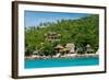 A traditional Thai resort overlooks turquoise water on the tropical island of Koh Tao, Thailand-Logan Brown-Framed Photographic Print