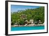 A traditional Thai resort overlooks turquoise water on the tropical island of Koh Tao, Thailand-Logan Brown-Framed Photographic Print