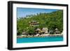 A traditional Thai resort overlooks turquoise water on the tropical island of Koh Tao, Thailand-Logan Brown-Framed Photographic Print