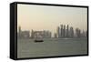 A Traditional Wooden Dhow Boat Sails Past Modern Skyscrapers, West Bay Financial District, Doha-Stuart Forster-Framed Stretched Canvas