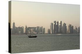 A Traditional Wooden Dhow Boat Sails Past Modern Skyscrapers, West Bay Financial District, Doha-Stuart Forster-Stretched Canvas