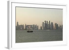 A Traditional Wooden Dhow Boat Sails Past Modern Skyscrapers, West Bay Financial District, Doha-Stuart Forster-Framed Photographic Print