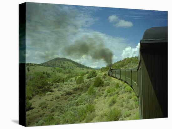 A Train is Seen Approaching Osier, Colorado, August 7, 2005-Deborah M. Baker-Stretched Canvas