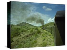 A Train is Seen Approaching Osier, Colorado, August 7, 2005-Deborah M. Baker-Stretched Canvas