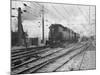 A Train Riding along an Electric Railroad-null-Mounted Photographic Print