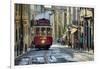 A tramway in Alfama district with the Motherchurch (Se Catedral) in the background. Lisbon, Portuga-Mauricio Abreu-Framed Photographic Print