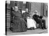 A Trio of Seniors on the Porch Watch the World Go By, Ca. 1900-null-Stretched Canvas