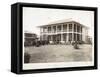 A Two-Story House Surrounded by Porches, with an American Flag Flying; in Panama During the…-Byron Company-Framed Stretched Canvas