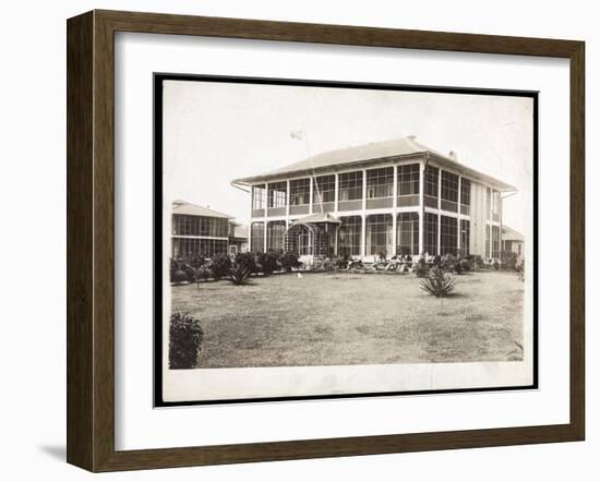 A Two-Story House Surrounded by Porches, with an American Flag Flying; in Panama During the…-Byron Company-Framed Giclee Print