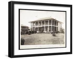 A Two-Story House Surrounded by Porches, with an American Flag Flying; in Panama During the…-Byron Company-Framed Giclee Print