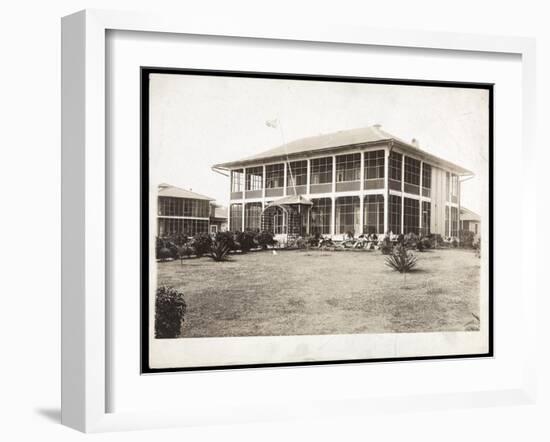 A Two-Story House Surrounded by Porches, with an American Flag Flying; in Panama During the…-Byron Company-Framed Giclee Print