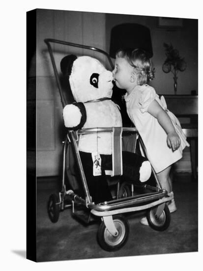 A Two Year Old Girl Kisses a Stuffed Panda on the Nose, Ca. 1955-null-Stretched Canvas