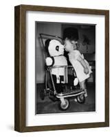 A Two Year Old Girl Kisses a Stuffed Panda on the Nose, Ca. 1955-null-Framed Photographic Print