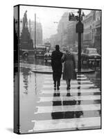 A Typical English Street on a Rainy Shopping Day: an Elderly Couple Use the Zebra Crossing-Henry Grant-Stretched Canvas