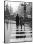 A Typical English Street on a Rainy Shopping Day: an Elderly Couple Use the Zebra Crossing-Henry Grant-Stretched Canvas