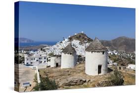 A Typical Greek Village Perched on a Rock with White and Blue Houses and Quaint Windmills, Ios-Roberto Moiola-Stretched Canvas