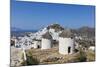 A Typical Greek Village Perched on a Rock with White and Blue Houses and Quaint Windmills, Ios-Roberto Moiola-Mounted Photographic Print