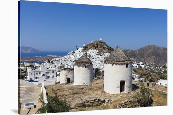 A Typical Greek Village Perched on a Rock with White and Blue Houses and Quaint Windmills, Ios-Roberto Moiola-Stretched Canvas