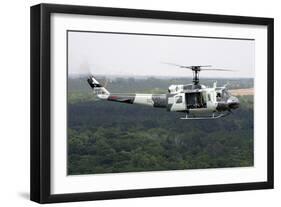 A U.S. Air Force Uh-1H Huey in an Experiment Paint Scheme-null-Framed Photographic Print