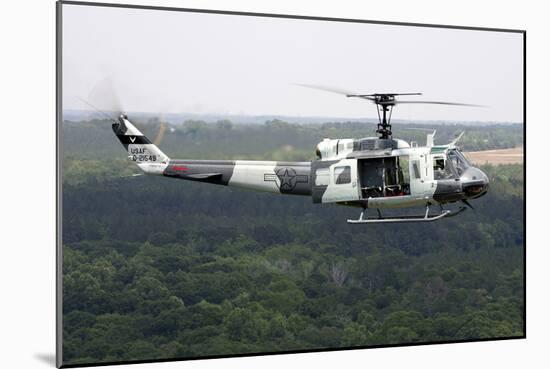 A U.S. Air Force Uh-1H Huey in an Experiment Paint Scheme-null-Mounted Photographic Print