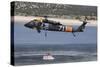 A U.S. Army Uh-60 Black Hawk Helicopter Collects Water from a Reservoir-null-Stretched Canvas